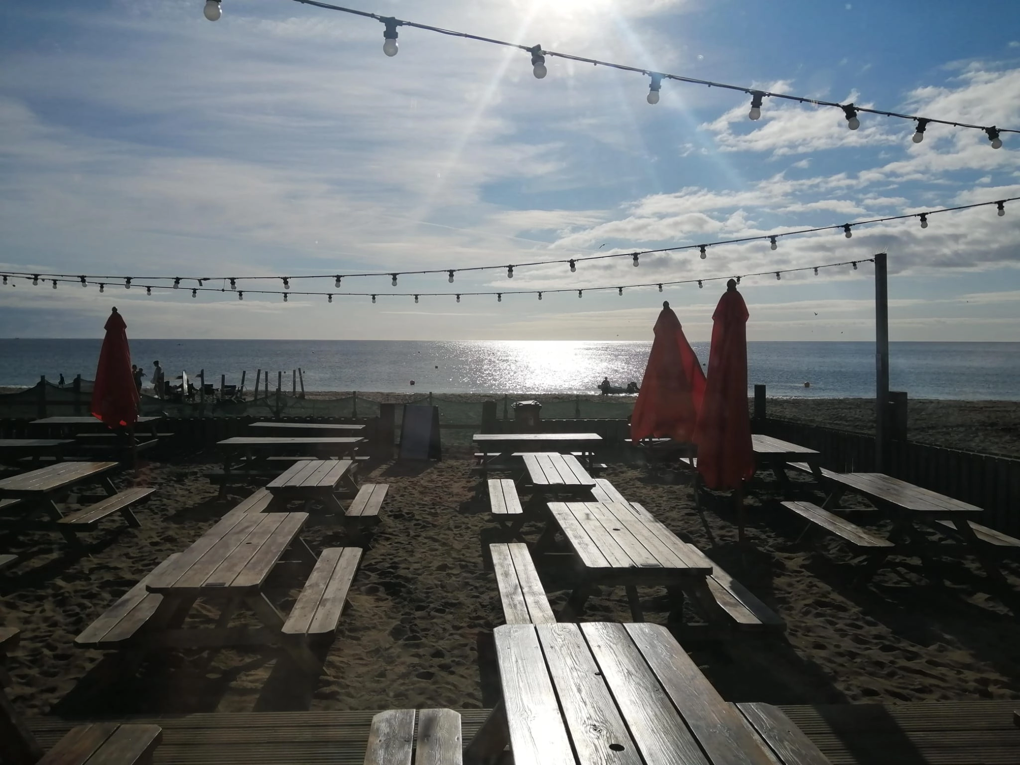 The Hubbox restaurant with its outdoor seating area directly on Pentewan Beach, Cornwall